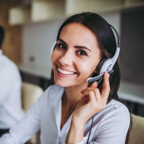 tele communicator smiling at camera