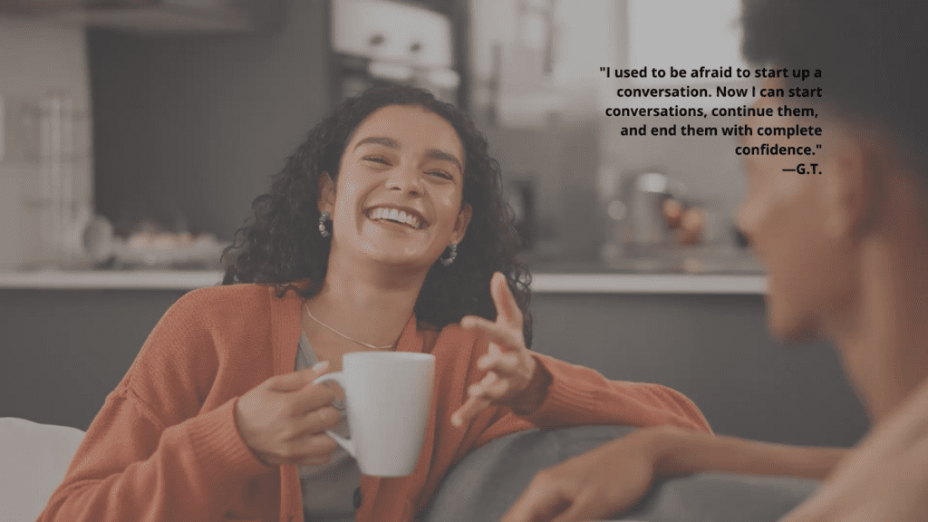 Woman laughing while in intimate conversation with person on couch