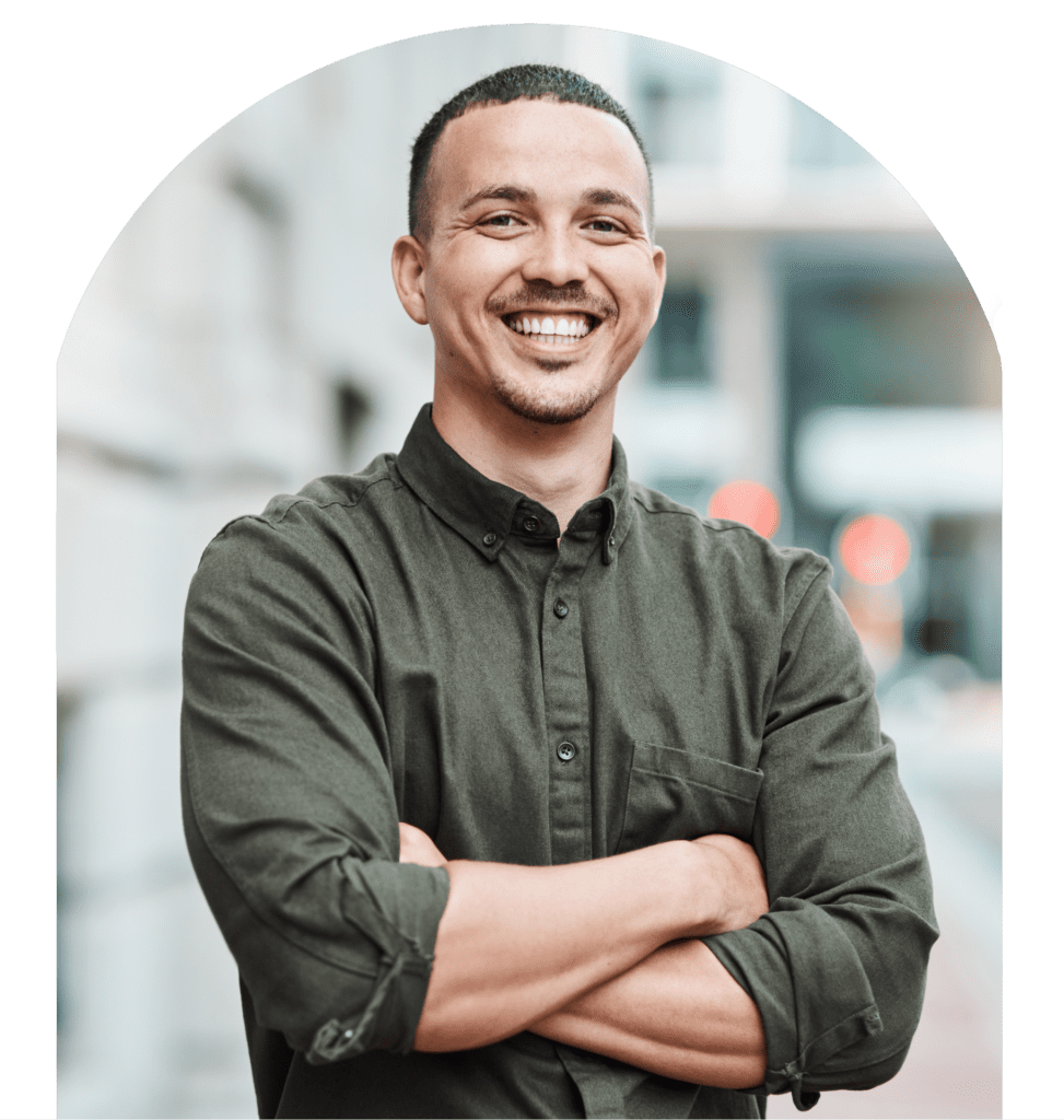 Young man standing confidently with crossed arms